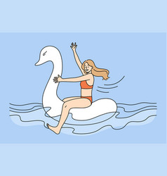 Happy Girl In Swimsuit Float On Rubber Swan