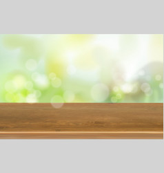 Wooden Table On Green Blurred Background