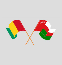 Crossed And Waving Flags Of Guinea Oman