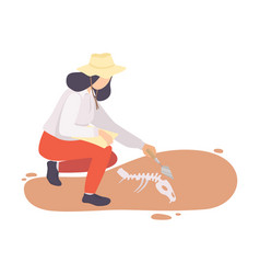 Female Archaeologist Sweeping Dirt From Bones