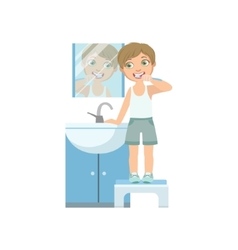 Boy Brushing The Teeth In Front Of Mirror