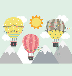 Three Hot Air Balloon Fly Over Mountains