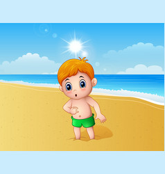 Boy Playing A Sand Using His Feet At The Beach