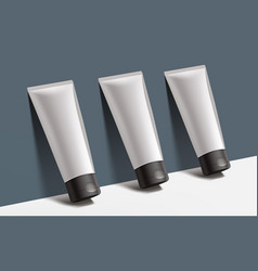 Plastic Tubes Moisturizer Cream On Dark Wall