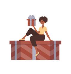 A Woman Sits On Gift Box Modern Style