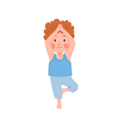 Cute Ginger Boy Standing In Yoga Pose On One Leg