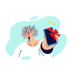 Elderly Woman Holds Phone With Gift Ribbon