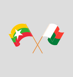 Crossed And Waving Flags Of Madagascar And Myanmar