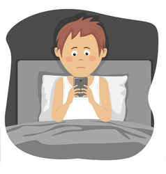 Teenager Boy Uses Smartphone Sitting In Bed