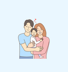 Happy Family With Baby In Hands