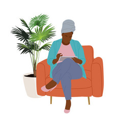 Black Woman With Digital Tablet In Armchair