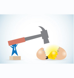 Businessman Holding Hammer To Break Egg