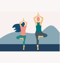 Two Women Practicing Tree Pose Yoga