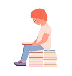 Cute Red Haired Boy Sitting On Pile Of Books