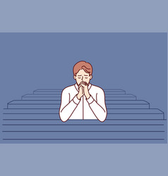 Christian Man Sits And Prays In Catholic Church