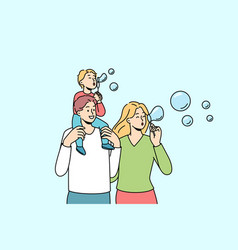 Happy Family With Kid Blowing Bubbles