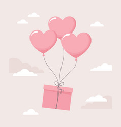 Gift Box Tied To Flying Heart Balloons On A Beige