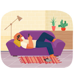 Guy Playing On Smartphone Is Lying On Violet Couch