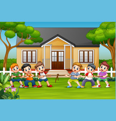 Happy Children Playing Tug War In Front A Hous