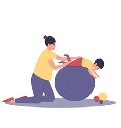 Mom And Baby Are Doing Exercises On A Large Ball