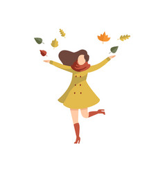 Young Woman Throwing Leaves Up Wearing Autumn