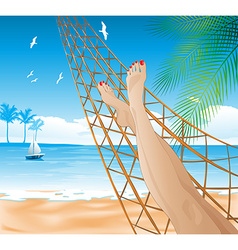 Woman Lying In A Hammock On The Beach