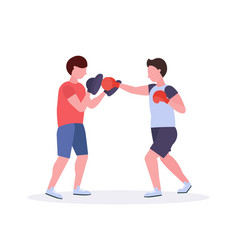 Two Men Boxers Exercising Thai Boxing In Red