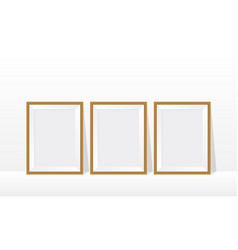 Three Wood Frame On Floor White Wall 3d Mockup