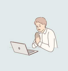 Man Manager Prays Sitting At Table With Laptop