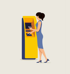 Woman Using Atm And Smartphone