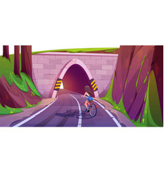 Girl Cycling On Highway With Tunnel Through Hill