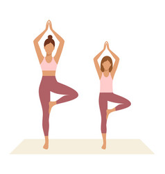 Mother And Daughter Standing In Tree Asana Or