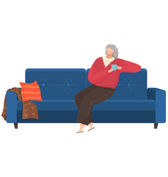 Adult Woman Sitting On Couch At Home Drinking