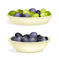 Olive Green And Black Pitted Fruit Rested On Plate