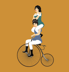 Two Circus Women On A Retro Bicycle