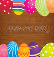 easter eggs on wooden background vector image