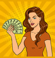 young woman with cash dollars pop art vector image