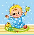 cute baby sits on the floor and plays with toys vector image