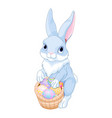 easter bunny with a basket full of eggs vector image vector image