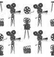 camera film reel and clapperboard vintage vector image