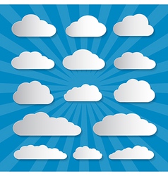 Clouds cut from paper on blue background Vector Image