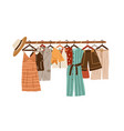 stylish fashion clothes hanging on hangers vector image