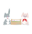 easter bunnies and eggs in wooden box vector image vector image