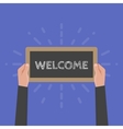 hand holding sign welcome vector image vector image