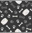 dog seamless pattern theme bone paw foot print vector image vector image