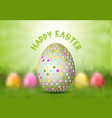easter egg on defocussed background vector image