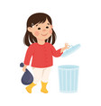 cute girl throwing garbage into trash can kid vector image