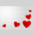 red paper hearts on a light wooden table vector image