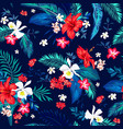 seamless tropical motif with leaves and flowers vector image vector image