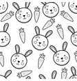 cute rabbit and carrots black and white seamless vector image vector image
